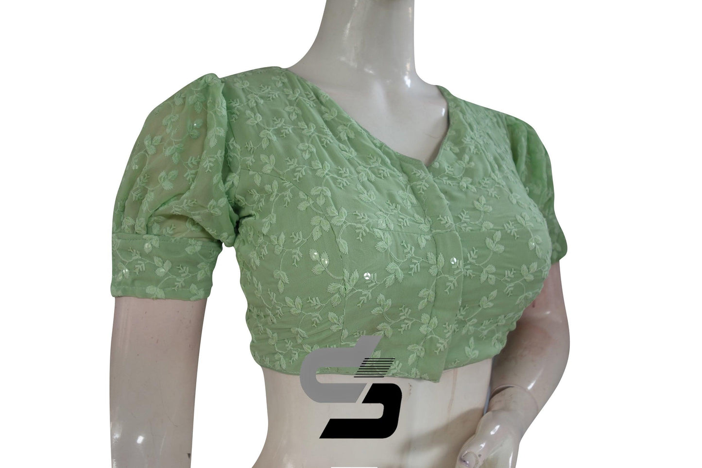 Embrace spring serenity with our Pastel Green High Neck Chikankari Saree Blouse featuring delicate puff sleeves, exuding elegance and grace with a touch of freshness.
