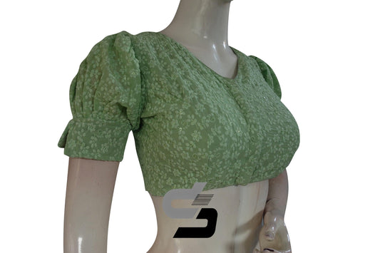 Elevate your style with our Pastel Green High Neck Chikankari Saree Blouse, boasting chic puff sleeves and intricate embroidery for a graceful and sophisticated ensemble.