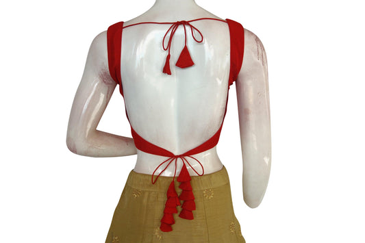 Make a statement with Scarlet Sensation, our Red Plain Semi Silk Designer Readymade Saree Blouse. Crafted from luxurious semi-silk fabric, this bold red blouse exudes elegance and charm. Elevate your saree ensemble with its timeless appeal and sophisticated design.