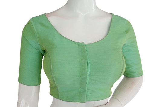 Emerald Elegance: Elevate your saree ensemble with this plain semi-silk Indian readymade blouse. The rich emerald hue exudes sophistication and elegance, while the semi-silk fabric adds a luxurious touch. Perfect for adding a dash of glamour to any occasion